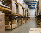 industrial warehouse interior with shelves and pallets with cartons